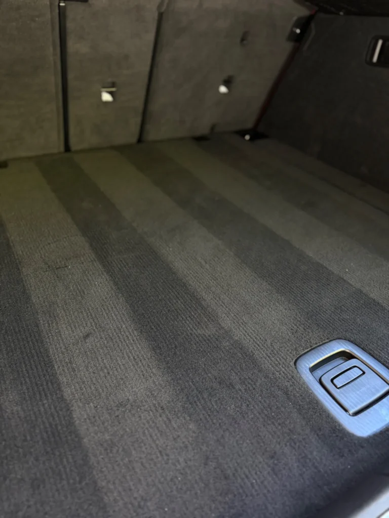 Interior car detailing in Massachusetts showing a freshly cleaned trunk area with professional vacuum lines | Massachusetts car detail in MA | car truck rv and boat detailing and ceramic coating
